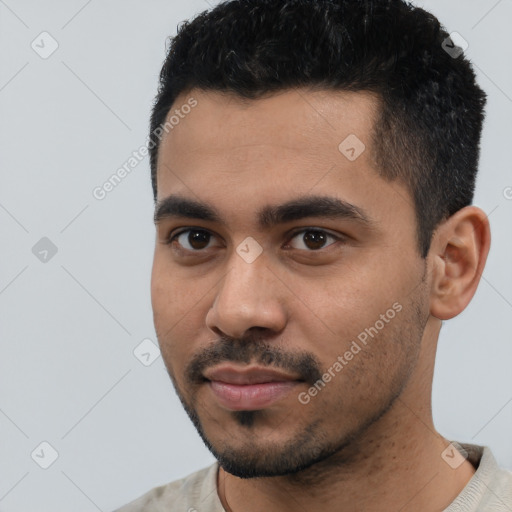 Neutral latino young-adult male with short  black hair and brown eyes