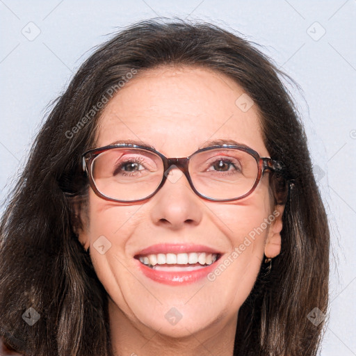 Joyful white adult female with long  brown hair and brown eyes