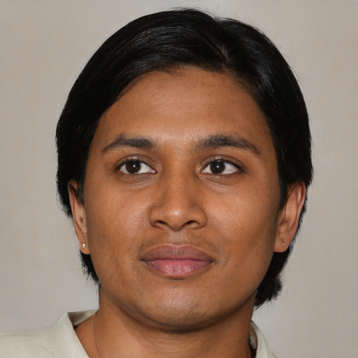 Joyful asian young-adult male with medium  black hair and brown eyes