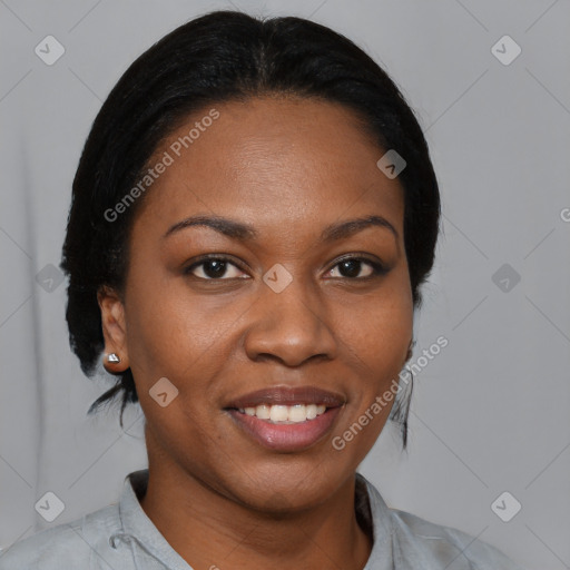 Joyful black young-adult female with medium  black hair and brown eyes