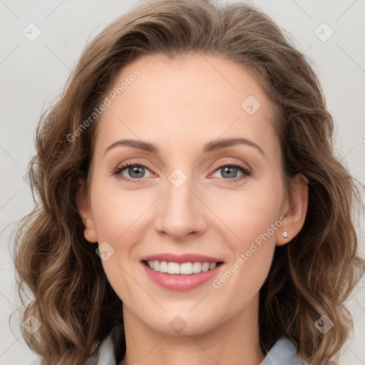 Joyful white young-adult female with long  brown hair and blue eyes