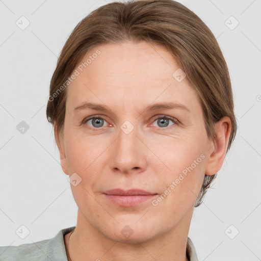 Joyful white adult female with short  brown hair and grey eyes