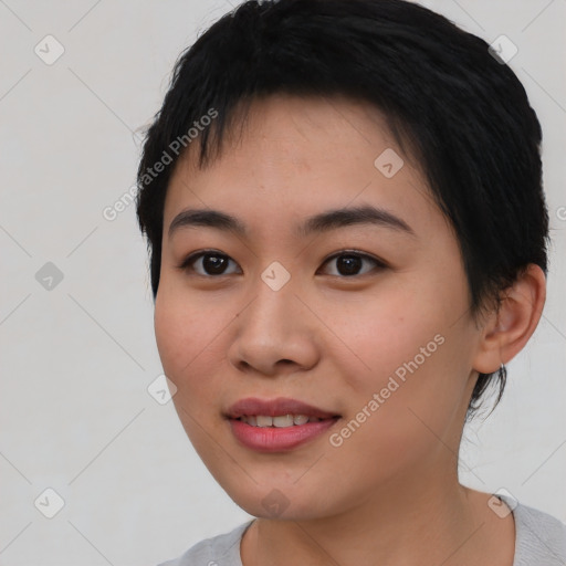 Joyful asian young-adult female with short  black hair and brown eyes