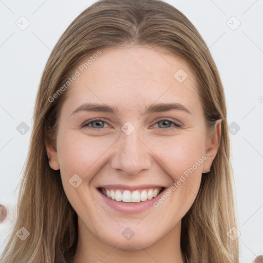 Joyful white young-adult female with long  brown hair and grey eyes