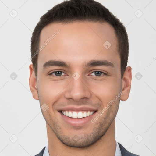 Joyful white young-adult male with short  brown hair and brown eyes