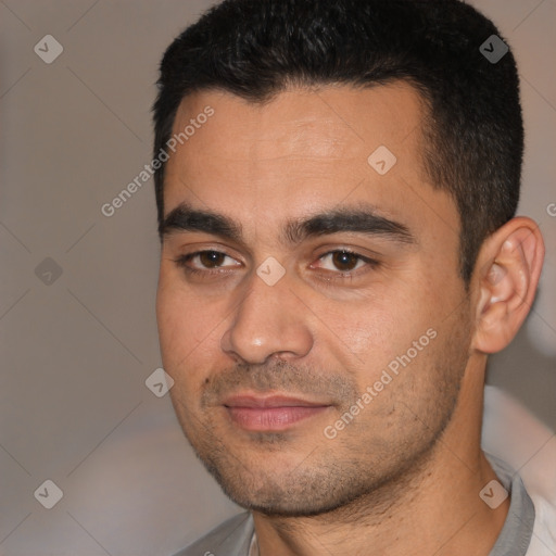 Joyful white young-adult male with short  black hair and brown eyes