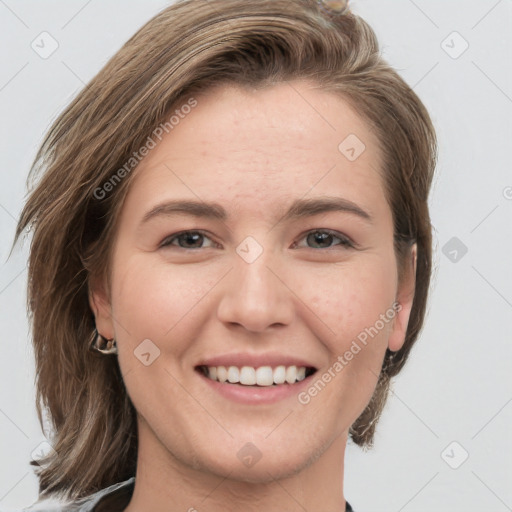 Joyful white young-adult female with medium  brown hair and grey eyes