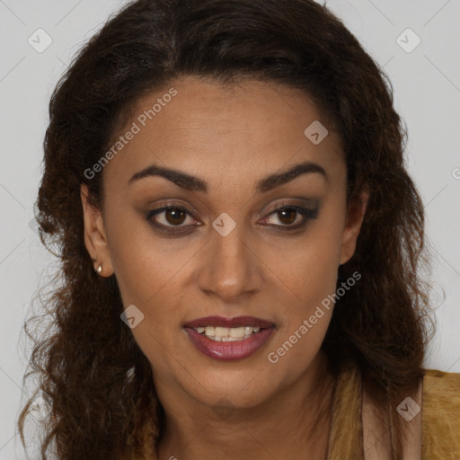 Joyful black young-adult female with long  brown hair and brown eyes