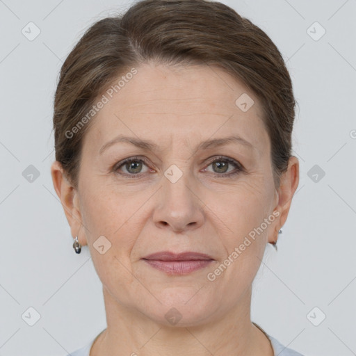 Joyful white adult female with short  brown hair and brown eyes