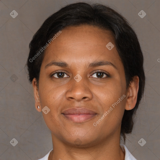 Joyful black young-adult female with medium  brown hair and brown eyes