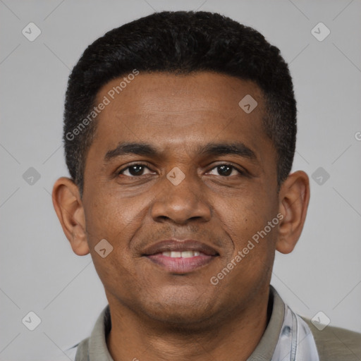 Joyful black young-adult male with short  black hair and brown eyes