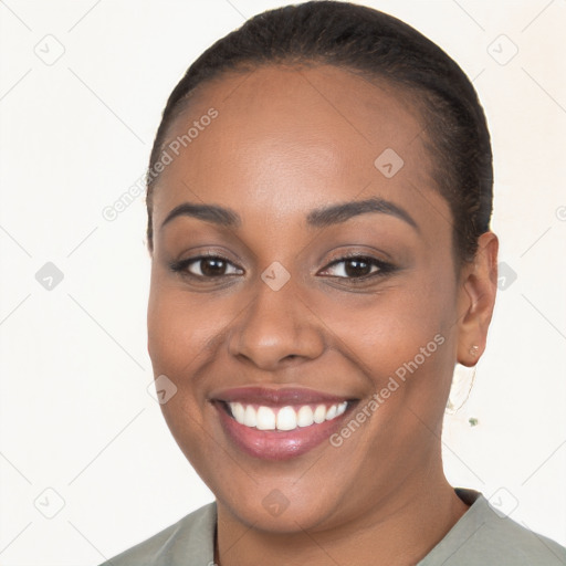 Joyful black young-adult female with short  brown hair and brown eyes