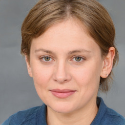 Joyful white young-adult female with medium  brown hair and blue eyes