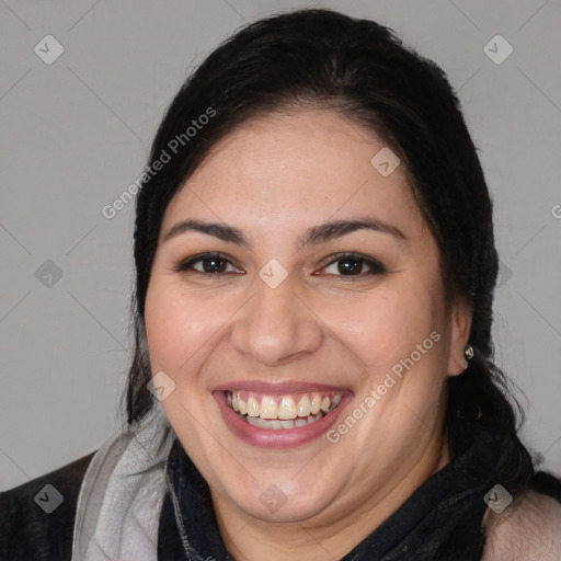 Joyful white young-adult female with long  brown hair and brown eyes