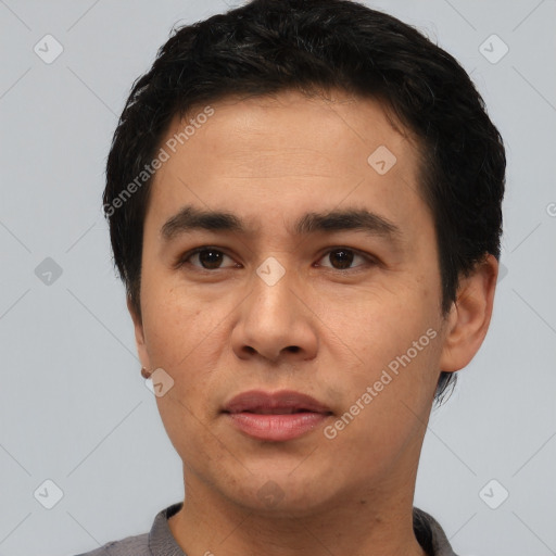 Joyful white young-adult male with short  black hair and brown eyes