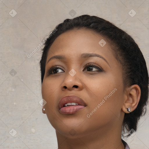 Joyful black young-adult female with medium  brown hair and brown eyes