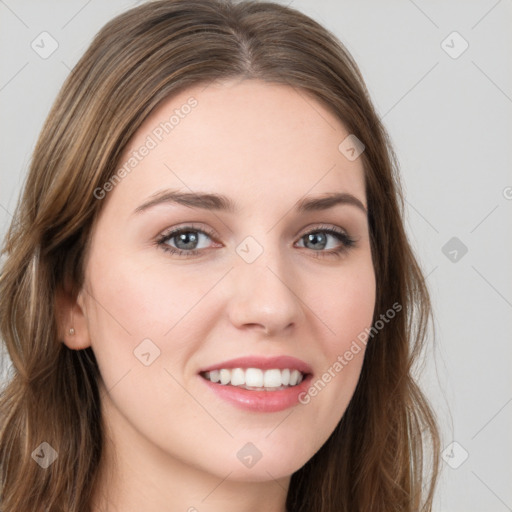 Joyful white young-adult female with long  brown hair and green eyes