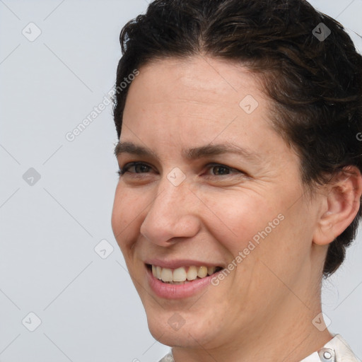 Joyful white adult female with short  brown hair and brown eyes