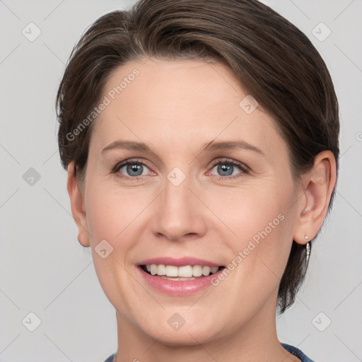 Joyful white adult female with medium  brown hair and grey eyes