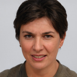 Joyful white adult female with short  brown hair and brown eyes