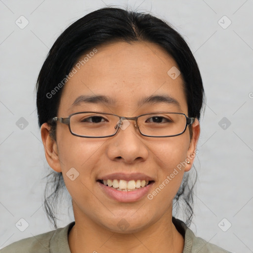 Joyful asian young-adult female with medium  black hair and brown eyes