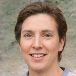 Joyful white adult female with short  brown hair and grey eyes