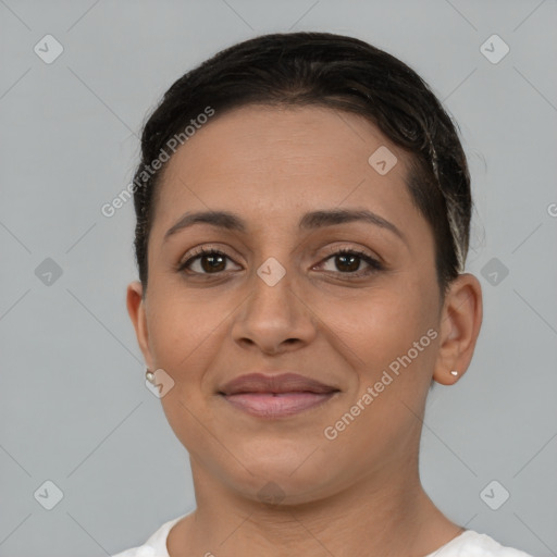 Joyful latino young-adult female with short  brown hair and brown eyes