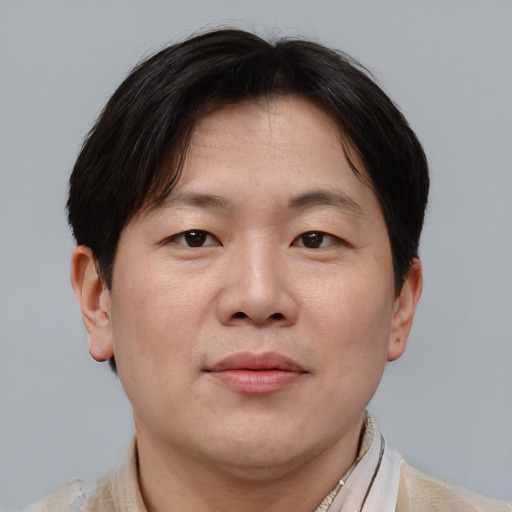 Neutral asian adult male with short  brown hair and brown eyes