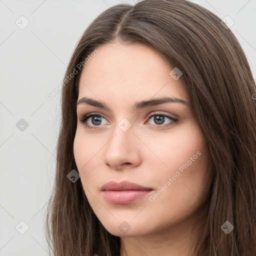 Neutral white young-adult female with long  brown hair and brown eyes