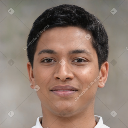 Joyful latino young-adult male with short  black hair and brown eyes