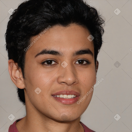 Joyful latino young-adult male with short  brown hair and brown eyes