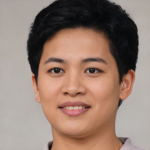 Joyful asian young-adult female with short  black hair and brown eyes