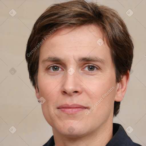 Joyful white adult male with medium  brown hair and grey eyes