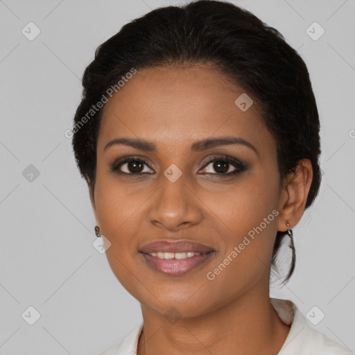 Joyful black young-adult female with medium  brown hair and brown eyes