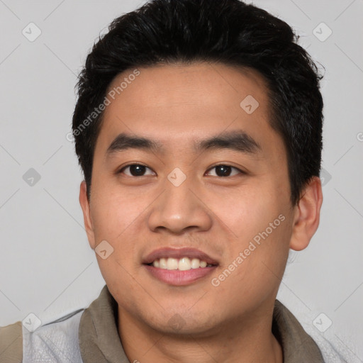 Joyful asian young-adult male with short  black hair and brown eyes