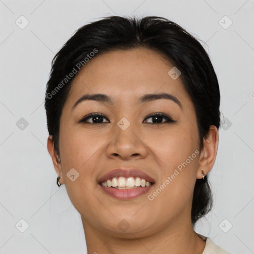 Joyful asian young-adult female with medium  black hair and brown eyes