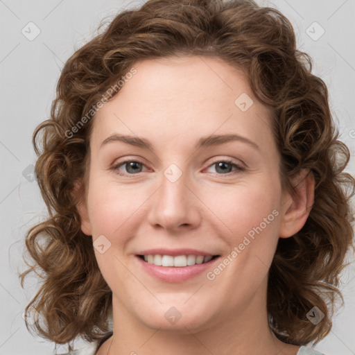 Joyful white young-adult female with medium  brown hair and green eyes