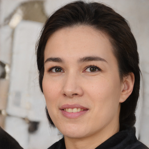 Joyful white young-adult female with medium  brown hair and brown eyes
