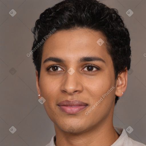 Joyful latino young-adult male with short  brown hair and brown eyes