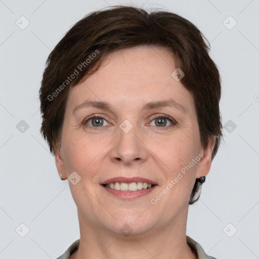 Joyful white adult female with short  brown hair and grey eyes