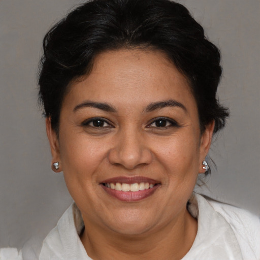 Joyful white adult female with short  brown hair and brown eyes