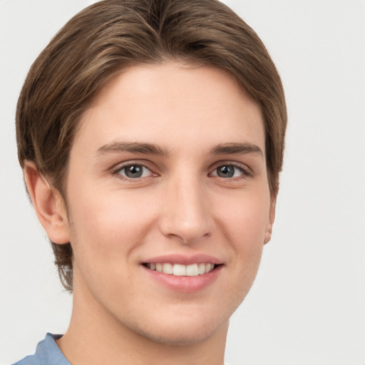 Joyful white young-adult female with short  brown hair and grey eyes