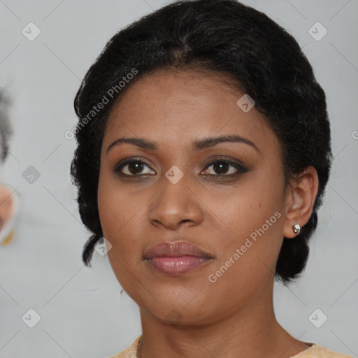 Joyful black young-adult female with medium  brown hair and brown eyes