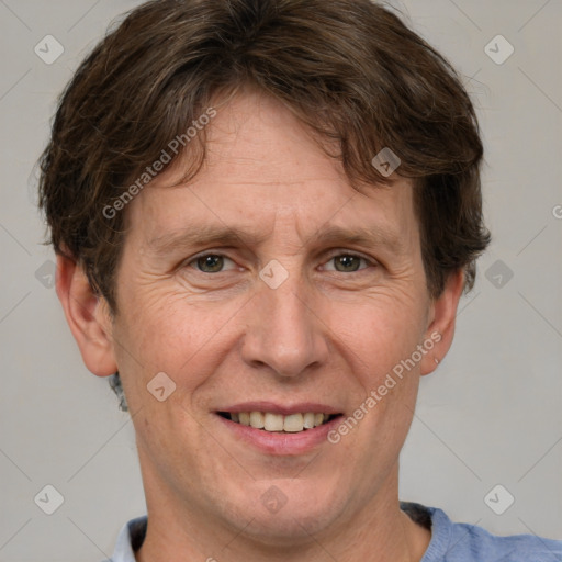 Joyful white adult male with short  brown hair and grey eyes