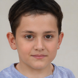 Joyful white child male with short  brown hair and brown eyes