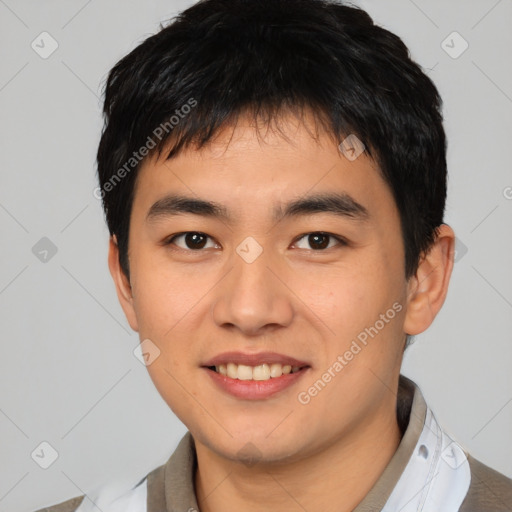 Joyful asian young-adult male with short  black hair and brown eyes