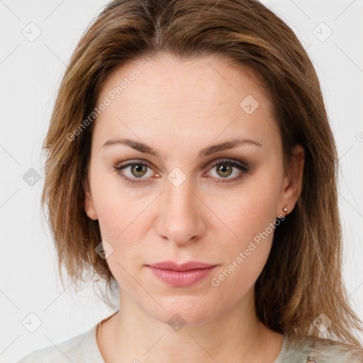 Joyful white young-adult female with medium  brown hair and green eyes