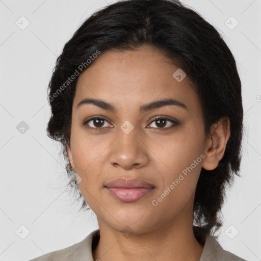 Joyful latino young-adult female with long  black hair and brown eyes