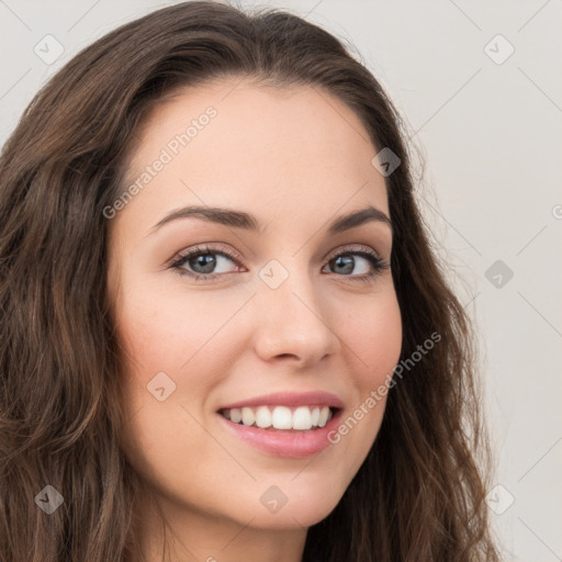 Joyful white young-adult female with long  brown hair and grey eyes