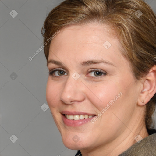 Joyful white adult female with medium  brown hair and grey eyes